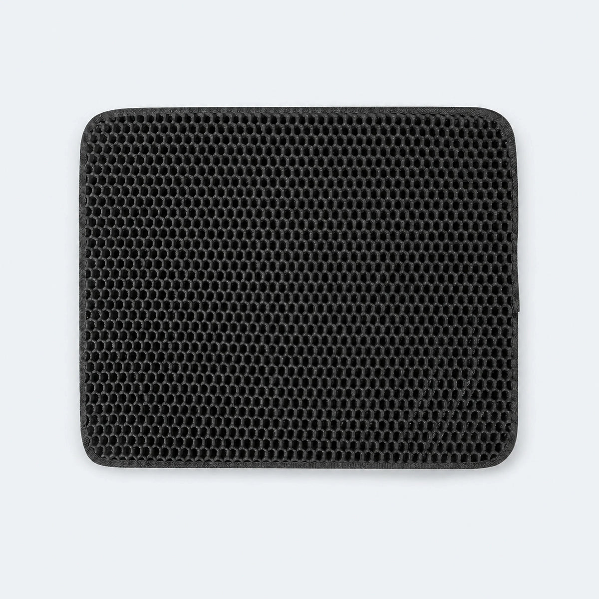 Cat litter trapping mat positioned outside a litter box