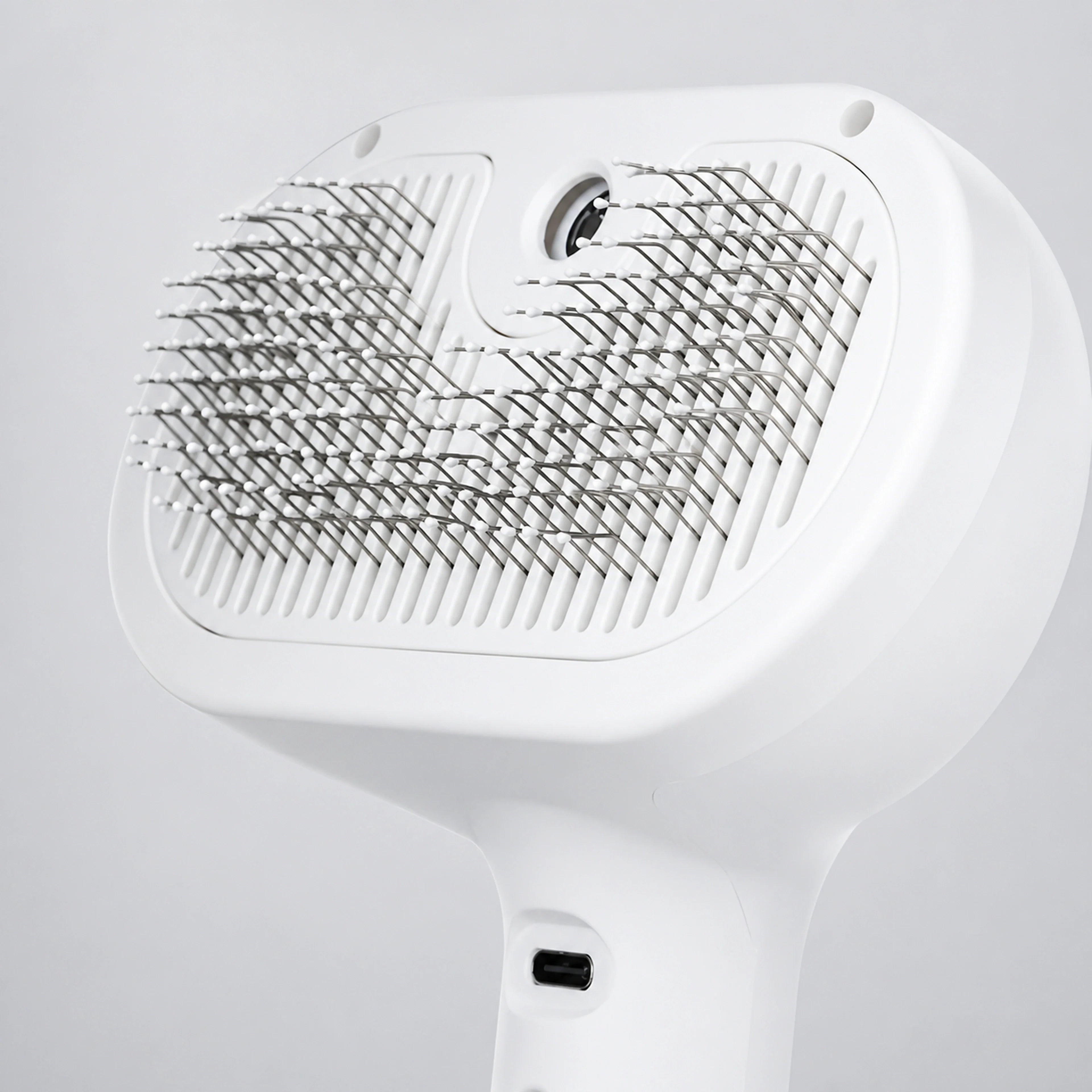 Rounded stainless-steel pin detail of pet grooming brush