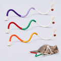 Three colorful cotton rope cat toys with tassels and a kitten