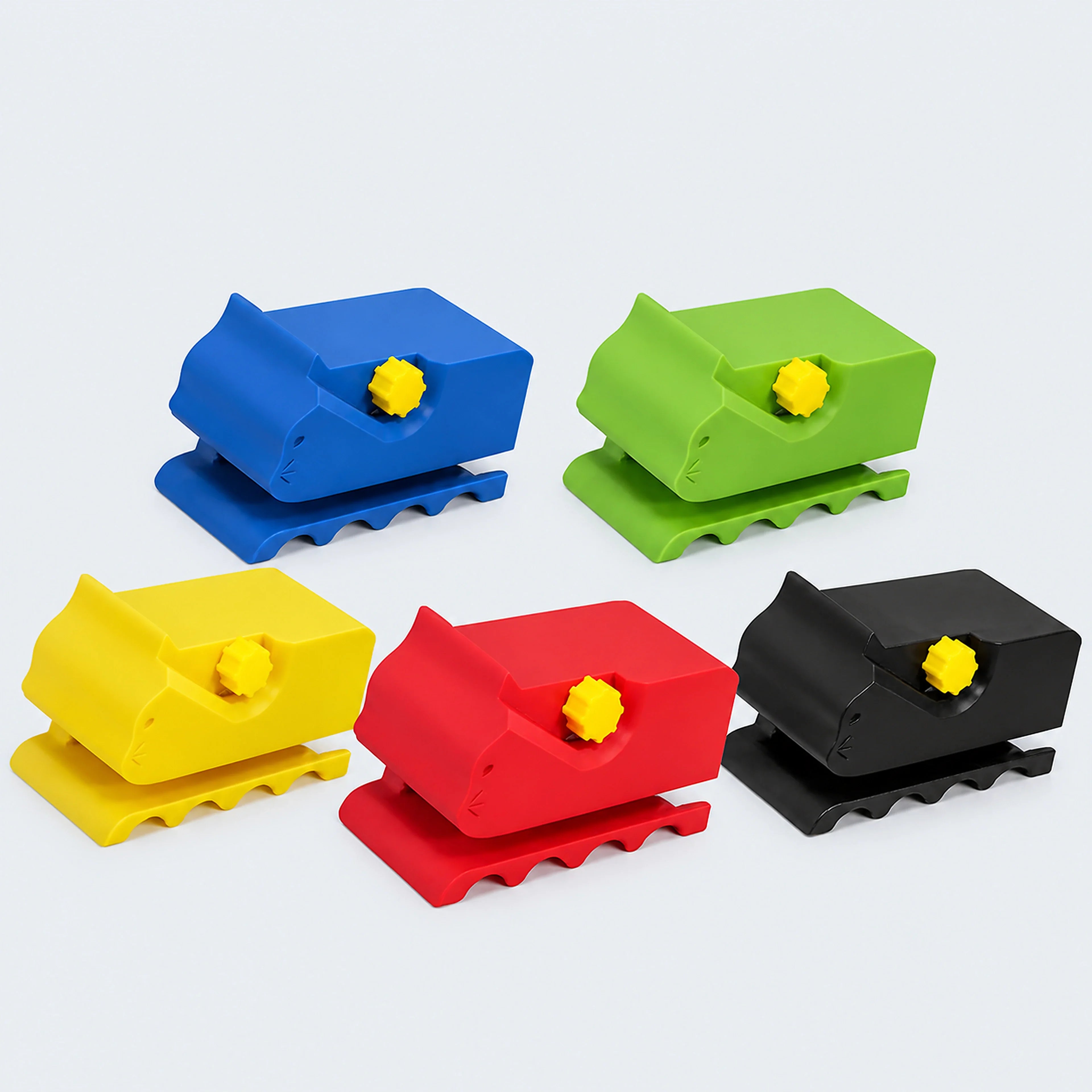 Five cardboard strip cutters in blue, green, yellow, red and black on a cool gray-blue background
