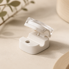 Off-white cable organizer clip in a tidy neutral bedside setting