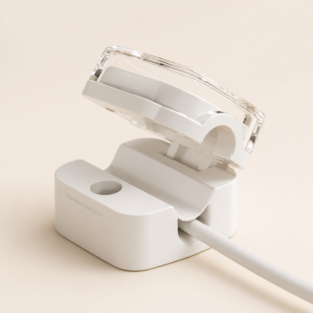 Three off-white cable organizer clips arranged neatly